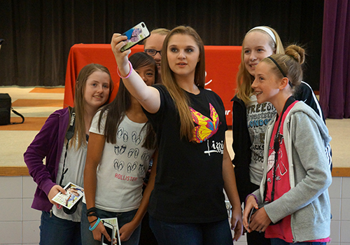 Lizzie Poses for Selfie with Students Lizzie Poses for Selfie with Students