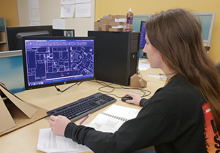 Samantha Riddell Works on Computer Model